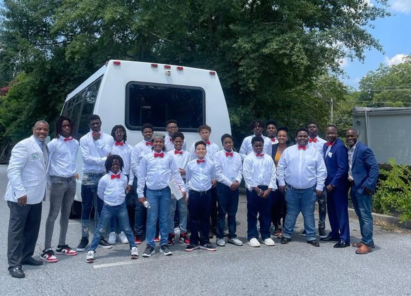 Dr. Bell with young men and mentors on the State of Black Boys Tour